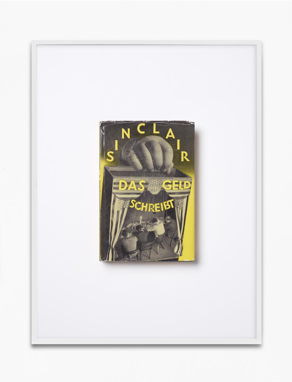 Buchcover von «Das Geld schreibt» von Sinclair in einem Bilderrahmen